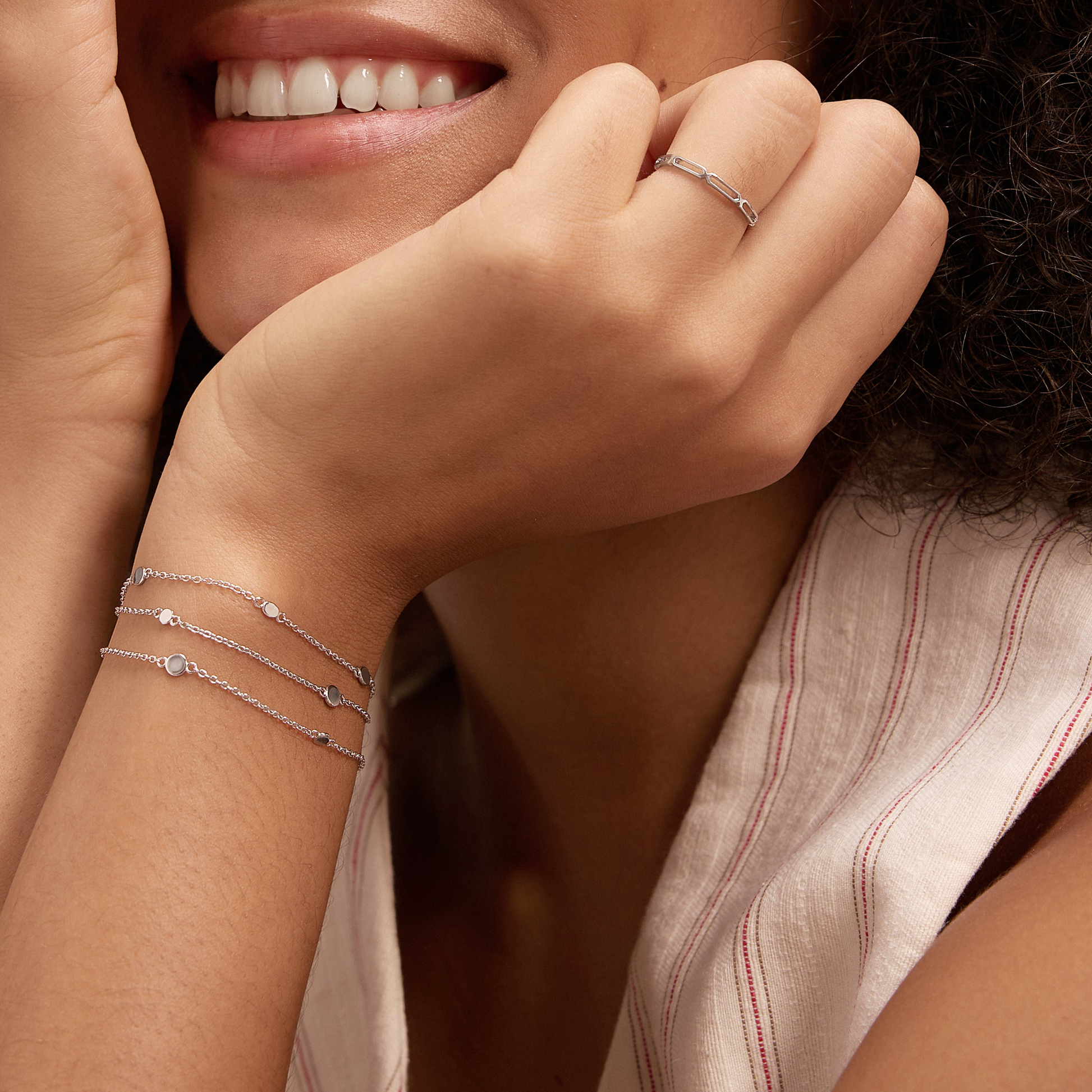 dainty silver bracelet with silver paperclip ring